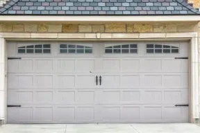 Carriage-house-style-steel-garage-door.webp